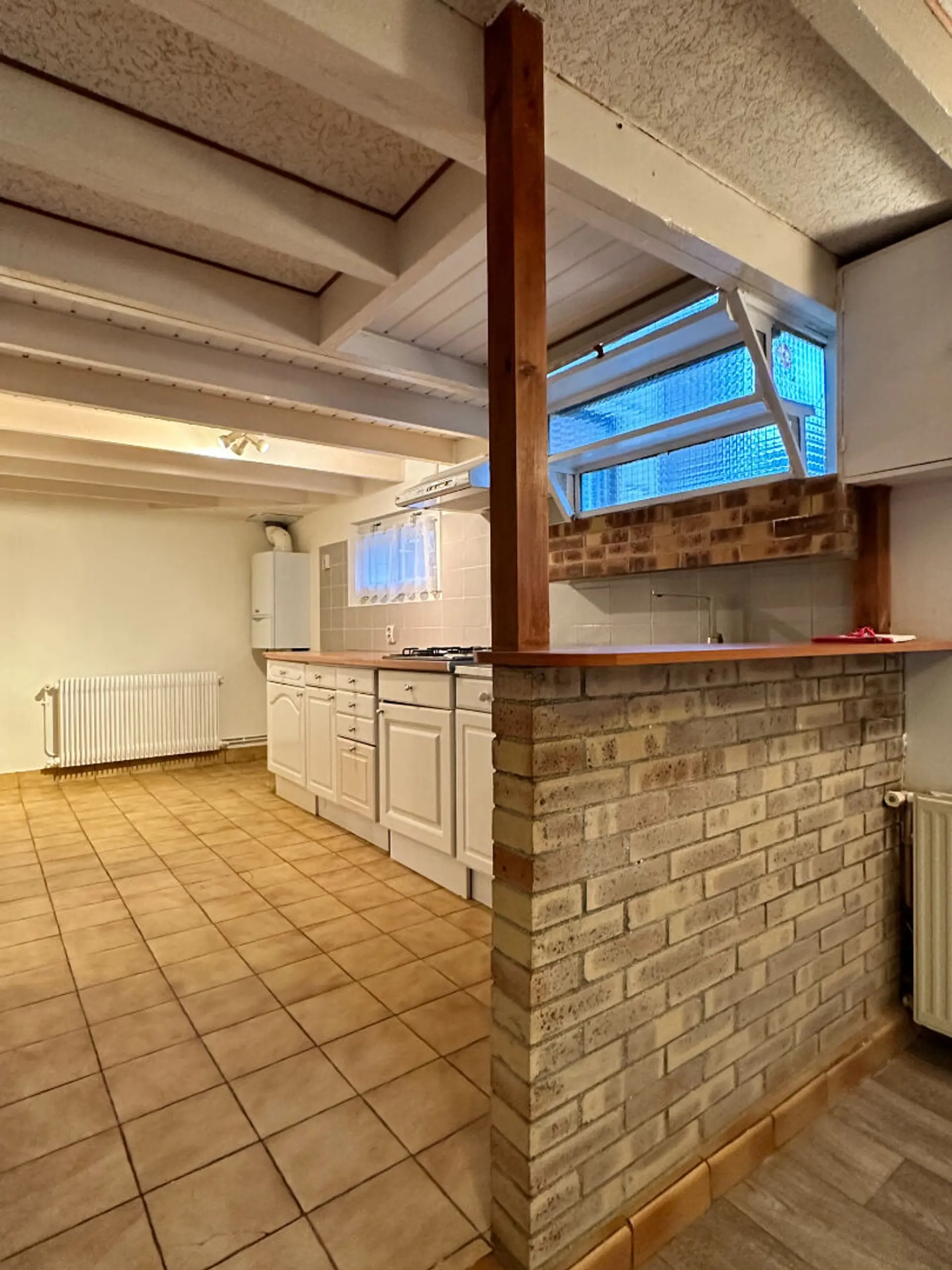 Maison 3 pièces 57 m² à Saint‑Brieuc – Quartier Robien, avec jardin constructible, garage et deux chambres.