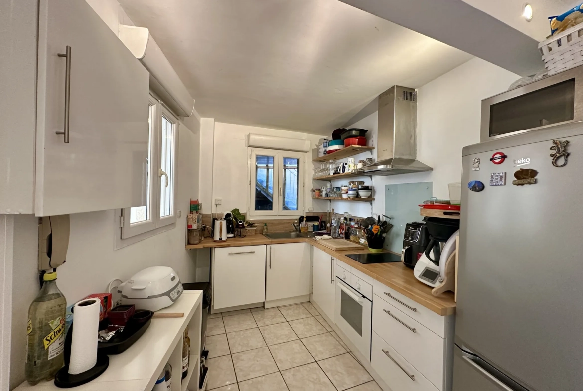 Appartement T2 de 55 m² à Lunel avec garage, terrasse et équipements modernes 