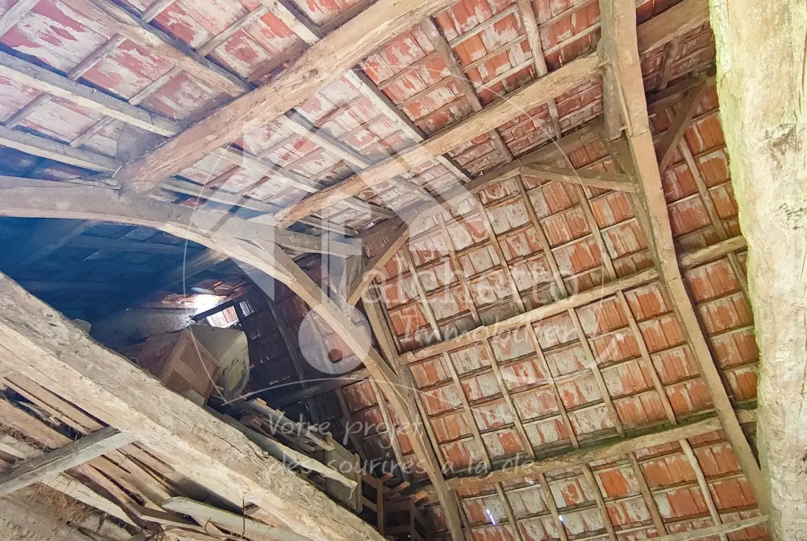 Grange à vendre avec terrain constructible à Saint Gérand-le-Puy 