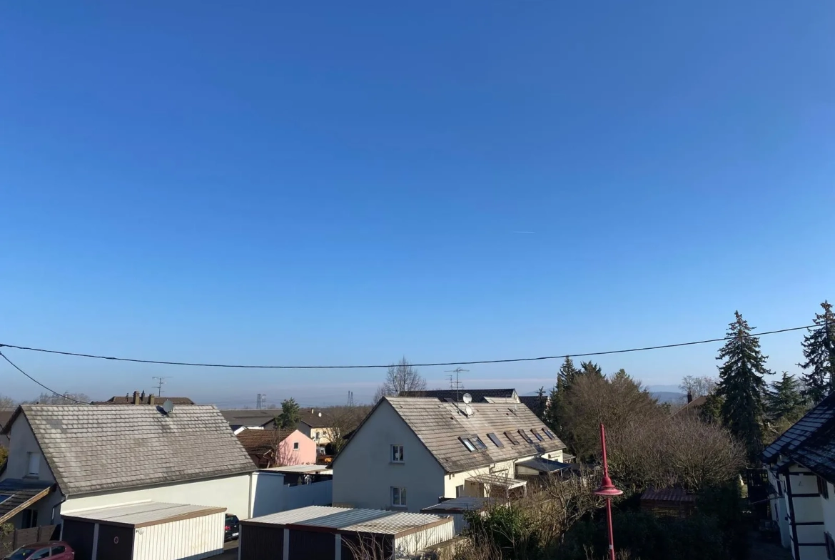 Appartement lumineux de 114 m² avec terrasse, garage et caves à Bartenheim 
