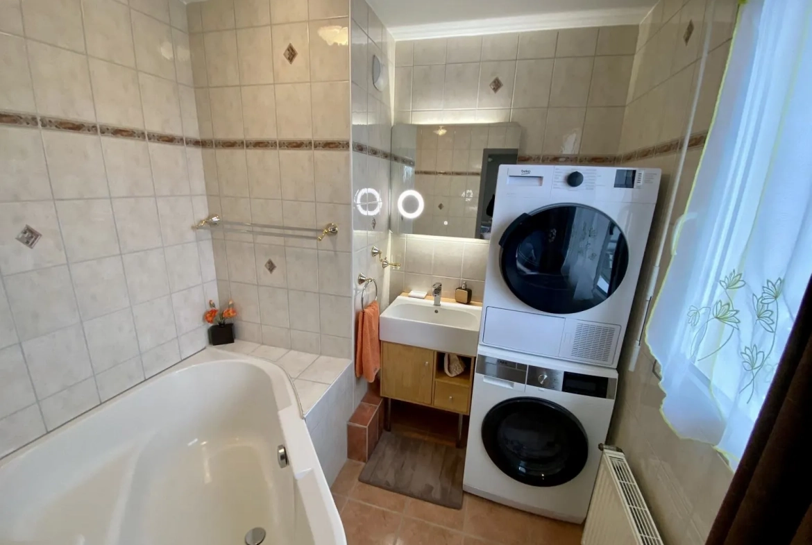 Appartement lumineux de 114 m² avec terrasse, garage et caves à Bartenheim 