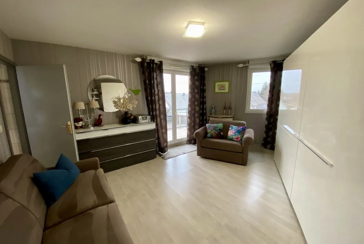 Appartement lumineux de 114 m² avec terrasse, garage et caves à Bartenheim 