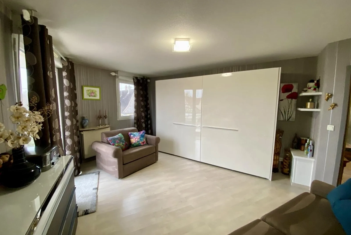 Appartement lumineux de 114 m² avec terrasse, garage et caves à Bartenheim 