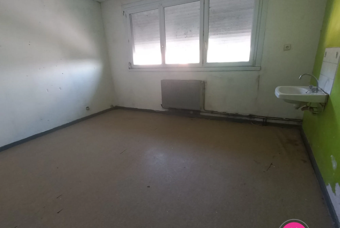 Maison à rénover de 92 m² avec 3 chambres et sous-sol complet à Bruay-sur-l'Escaut 