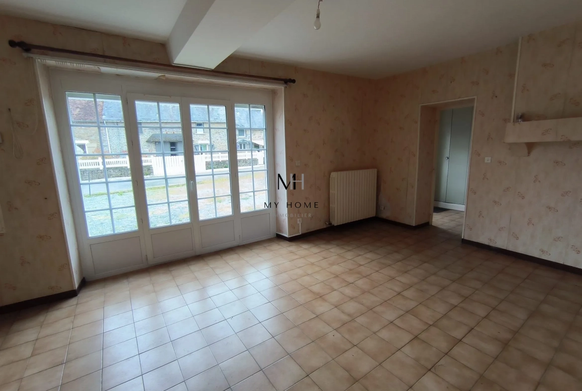 Longère à vendre à Saint-Pierre-des-Nids - 4 chambres, terrain clos et garage 