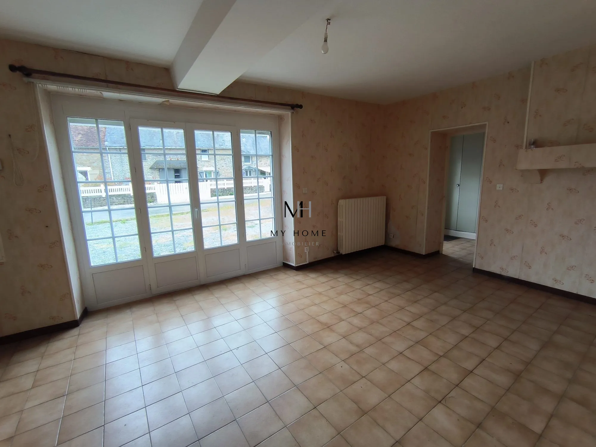 Longère à vendre à Saint-Pierre-des-Nids - 4 chambres, terrain clos et garage 