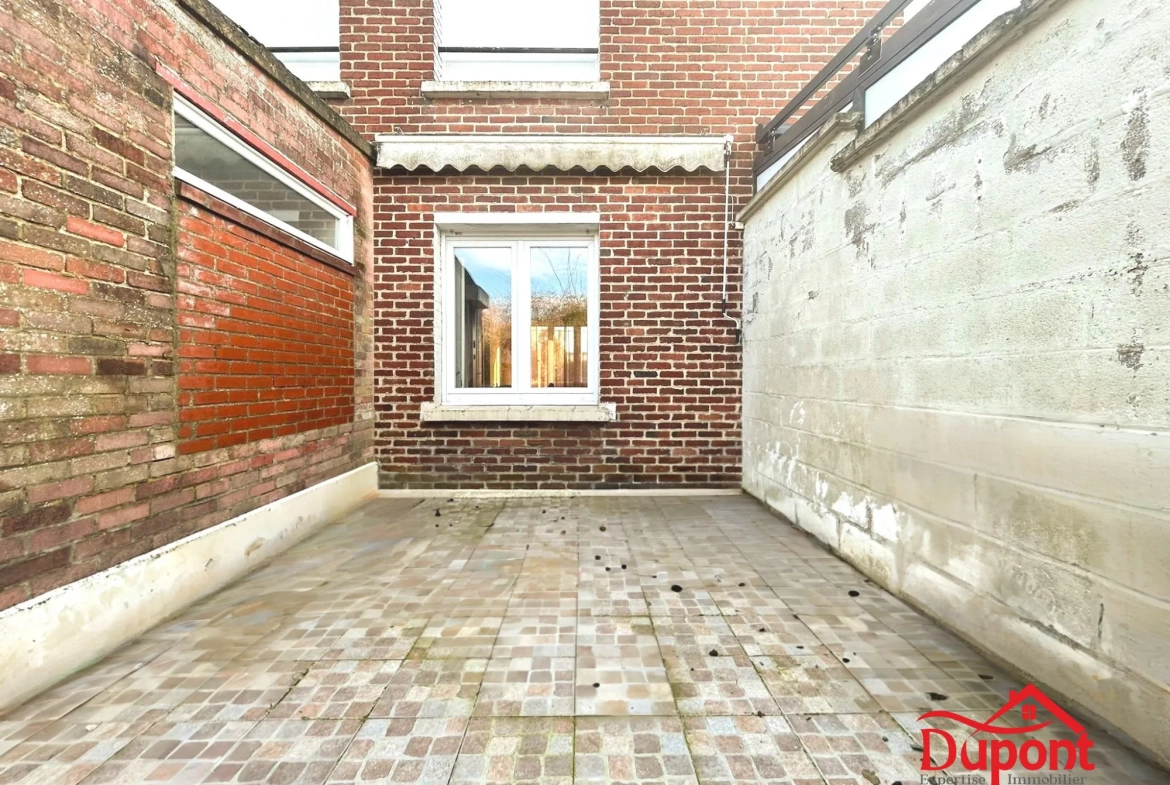 Maison mitoyenne de 90 m² avec jardin et garage à Neuville-Saint-Rémy 