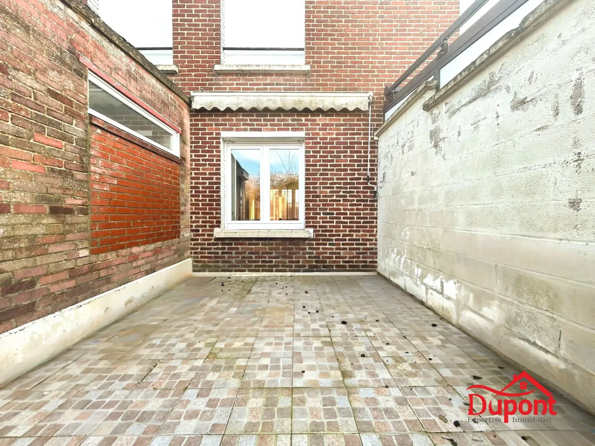 Maison mitoyenne de 90 m² avec jardin et garage à Neuville-Saint-Rémy 