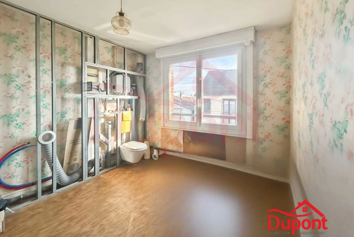 Maison mitoyenne de 90 m² avec jardin et garage à Neuville-Saint-Rémy 