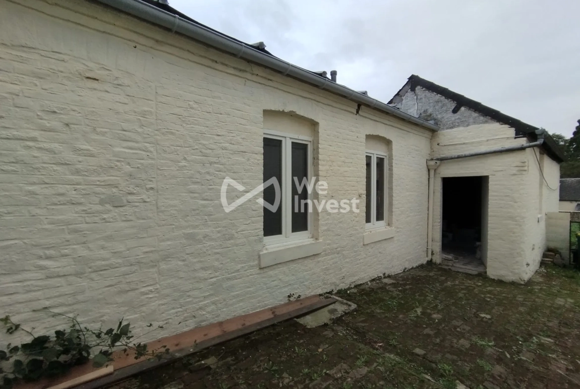 Immeuble de rapport à Fourmies avec potentiel de rénovation et jardin 