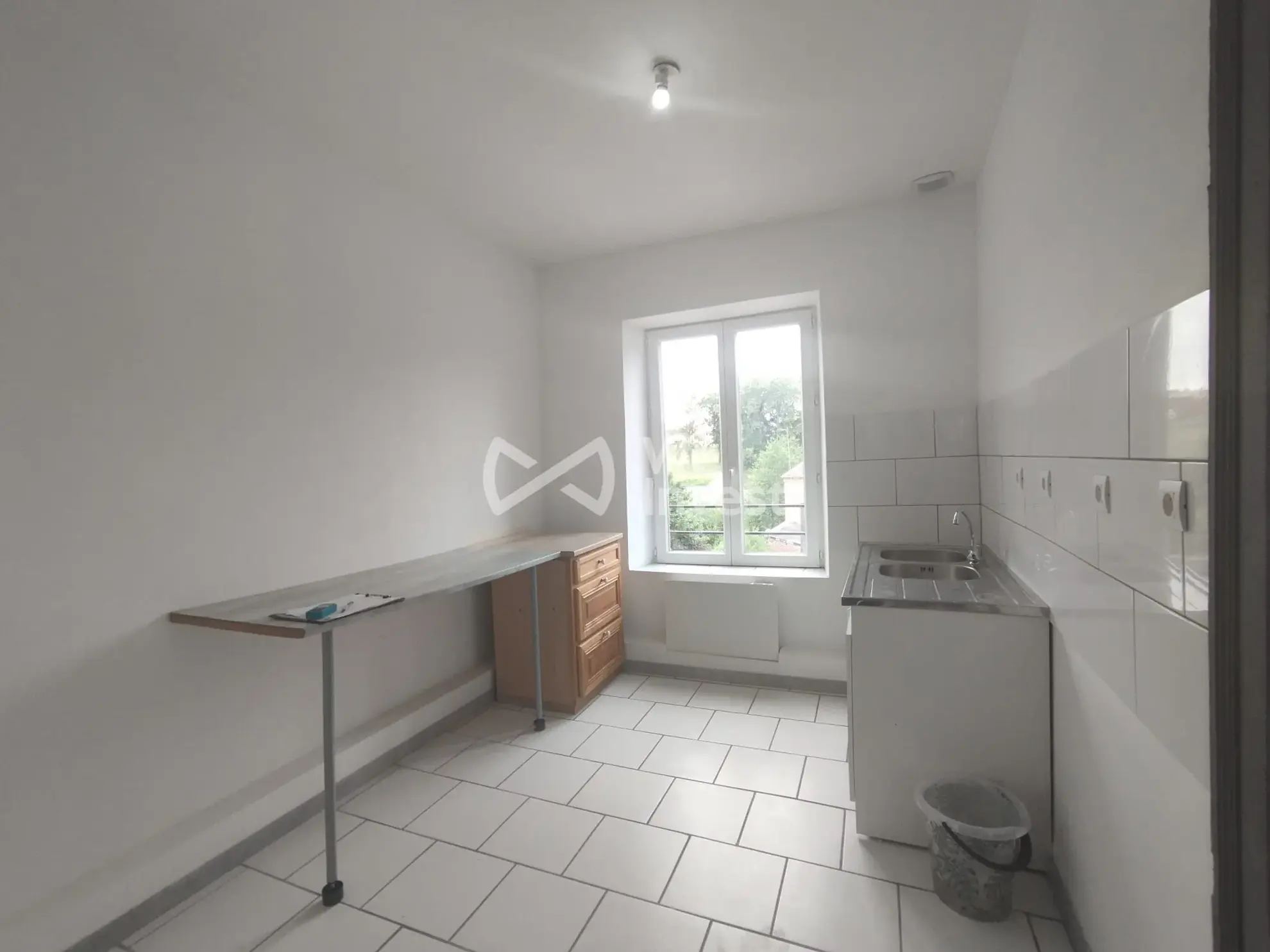 Immeuble de rapport à Fourmies avec potentiel de rénovation et jardin 