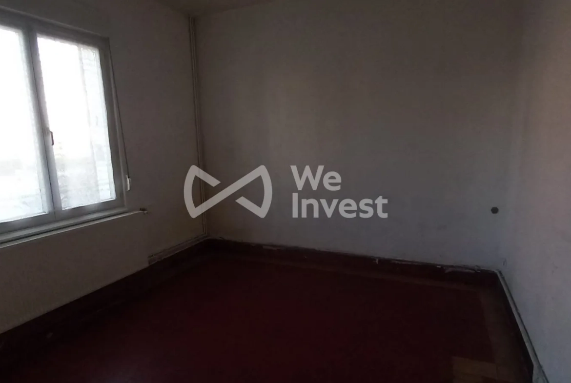 Ensemble immobilier à Sains-du-Nord avec 2 maisons, garage et parking, idéal pour investisseur 