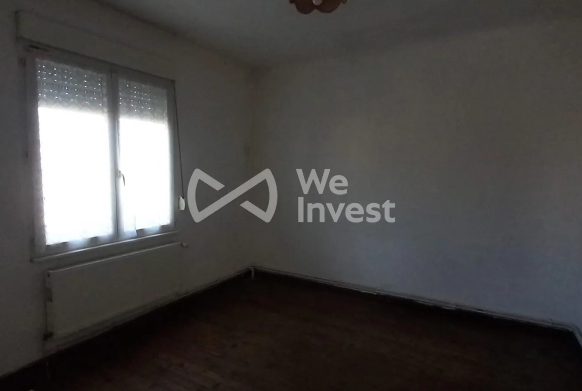 Ensemble immobilier à Sains-du-Nord avec 2 maisons, garage et parking, idéal pour investisseur 