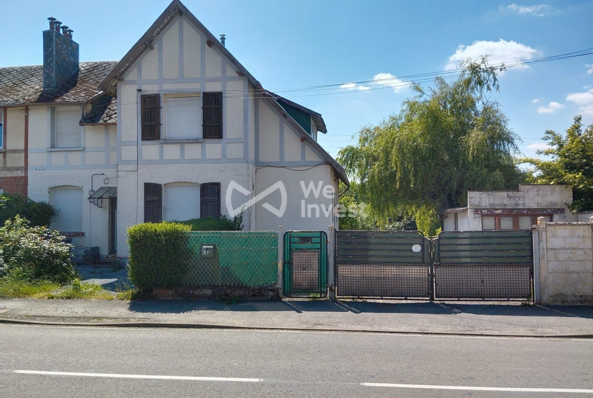 Ensemble immobilier à Sains-du-Nord avec 2 maisons, garage et parking, idéal pour investisseur 