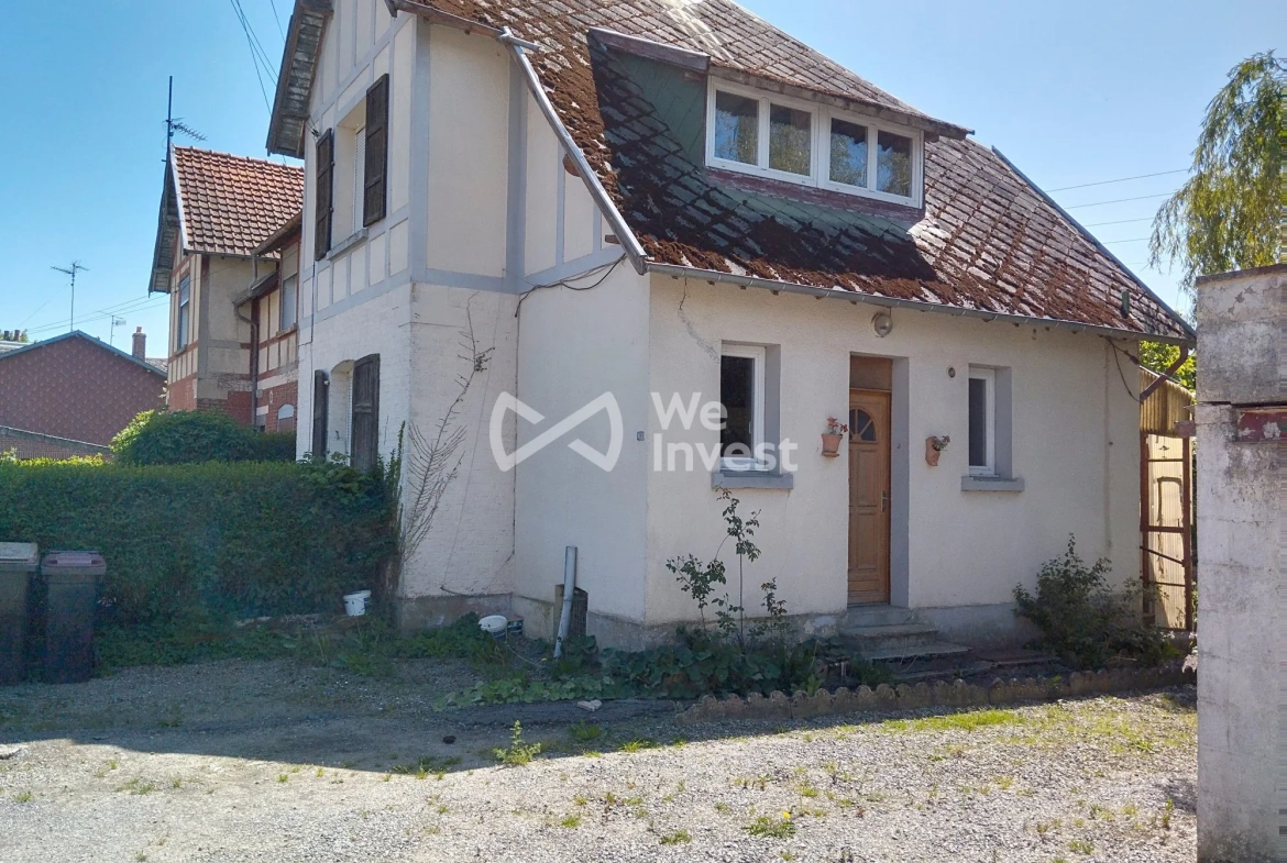 Ensemble immobilier à Sains-du-Nord avec 2 maisons, garage et parking, idéal pour investisseur 