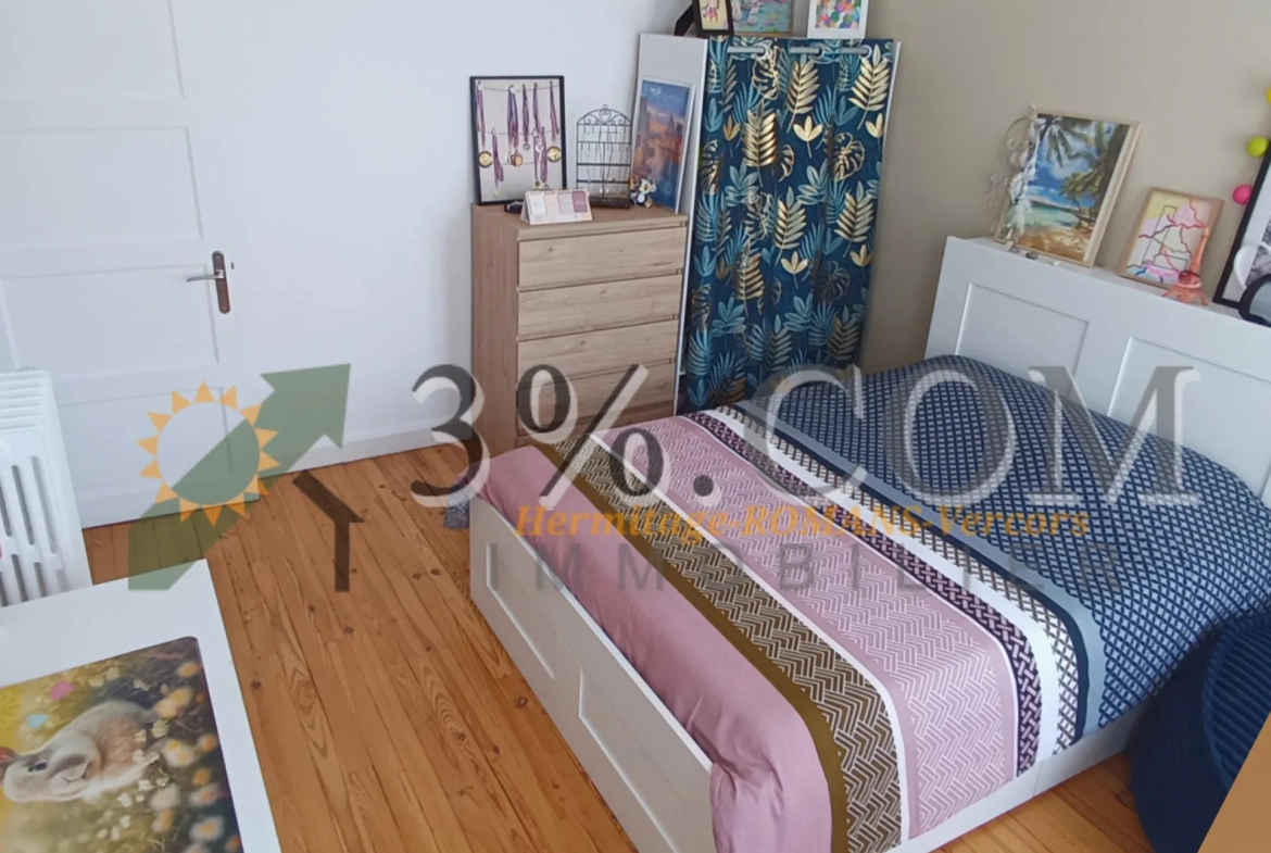Appartement T3 de 64m² avec parking et caves en centre-ville de Bourg-de-Péage 