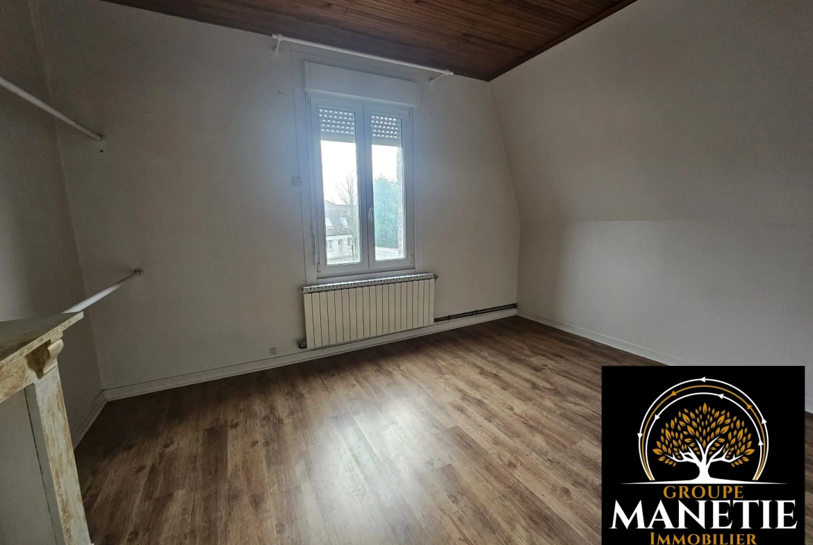 Maison à rénover à Douai avec jardin et garage - Secteur calme 