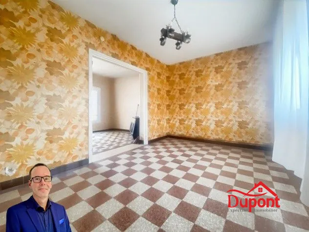 Maison à vendre à Douchy-les-Mines avec jardin, garage et cave 