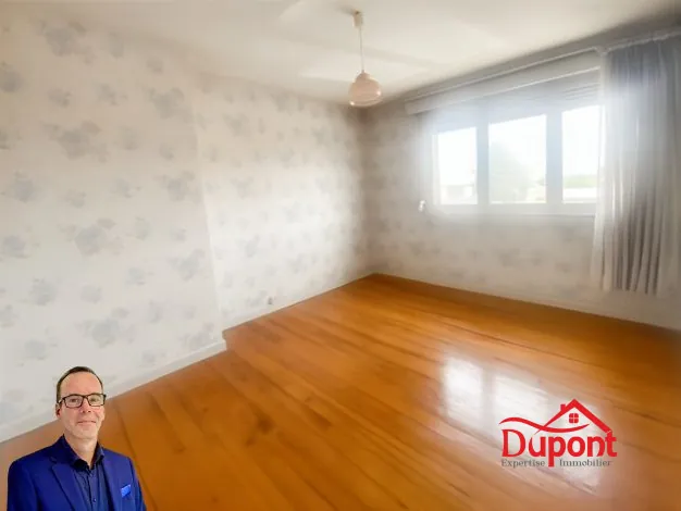 Maison à vendre à Douchy-les-Mines avec jardin, garage et cave 