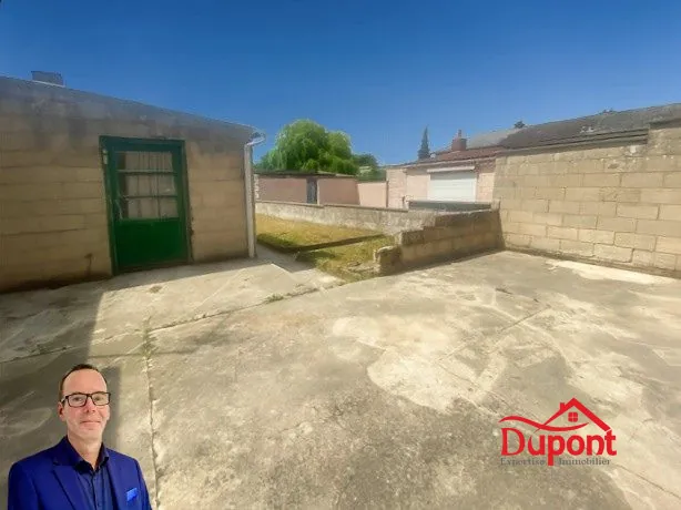 Maison à vendre à Douchy-les-Mines avec jardin, garage et cave 