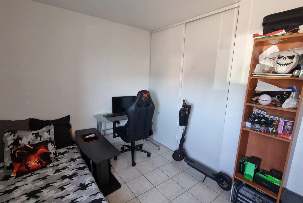 Vente d'un appartement T3 loué à Villerest avec parking et balcon 