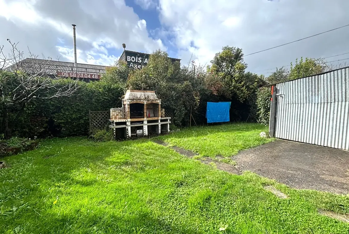 Maison ancienne de 108 m² à Peyrehorade, centre-ville avec garage et jardin 