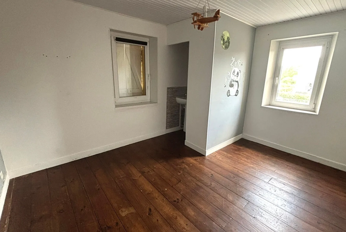 Maison ancienne de 108 m² à Peyrehorade, centre-ville avec garage et jardin 