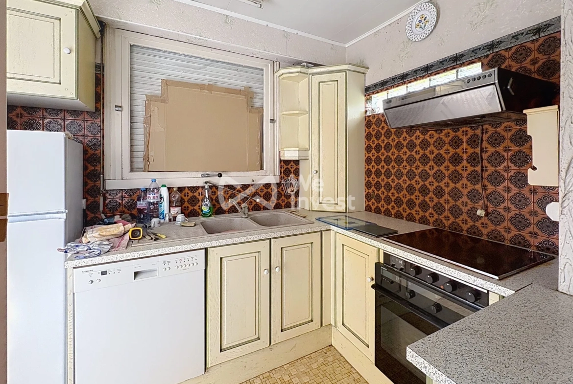 Maison à rénover de 80 m² avec jardin et garage à Aulnoye-Aymeries 