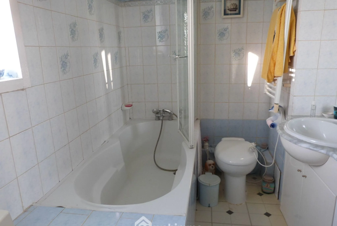 Maison jumelée 75 m² à Saint-Ouen-de-Thouberville avec garage et véranda 