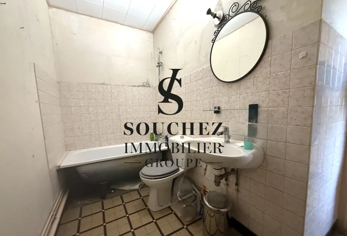 Appartement à rénover de 50m2 avec parking et cave à Sainte-Catherine 