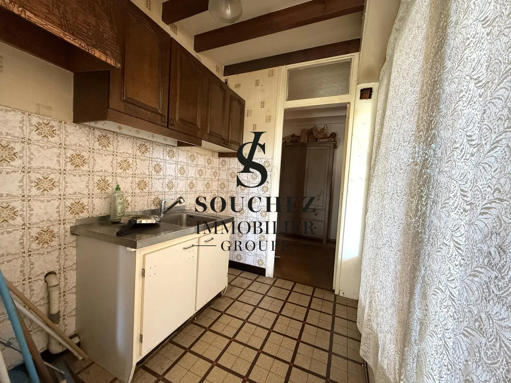 Appartement à rénover de 50m2 avec parking et cave à Sainte-Catherine 
