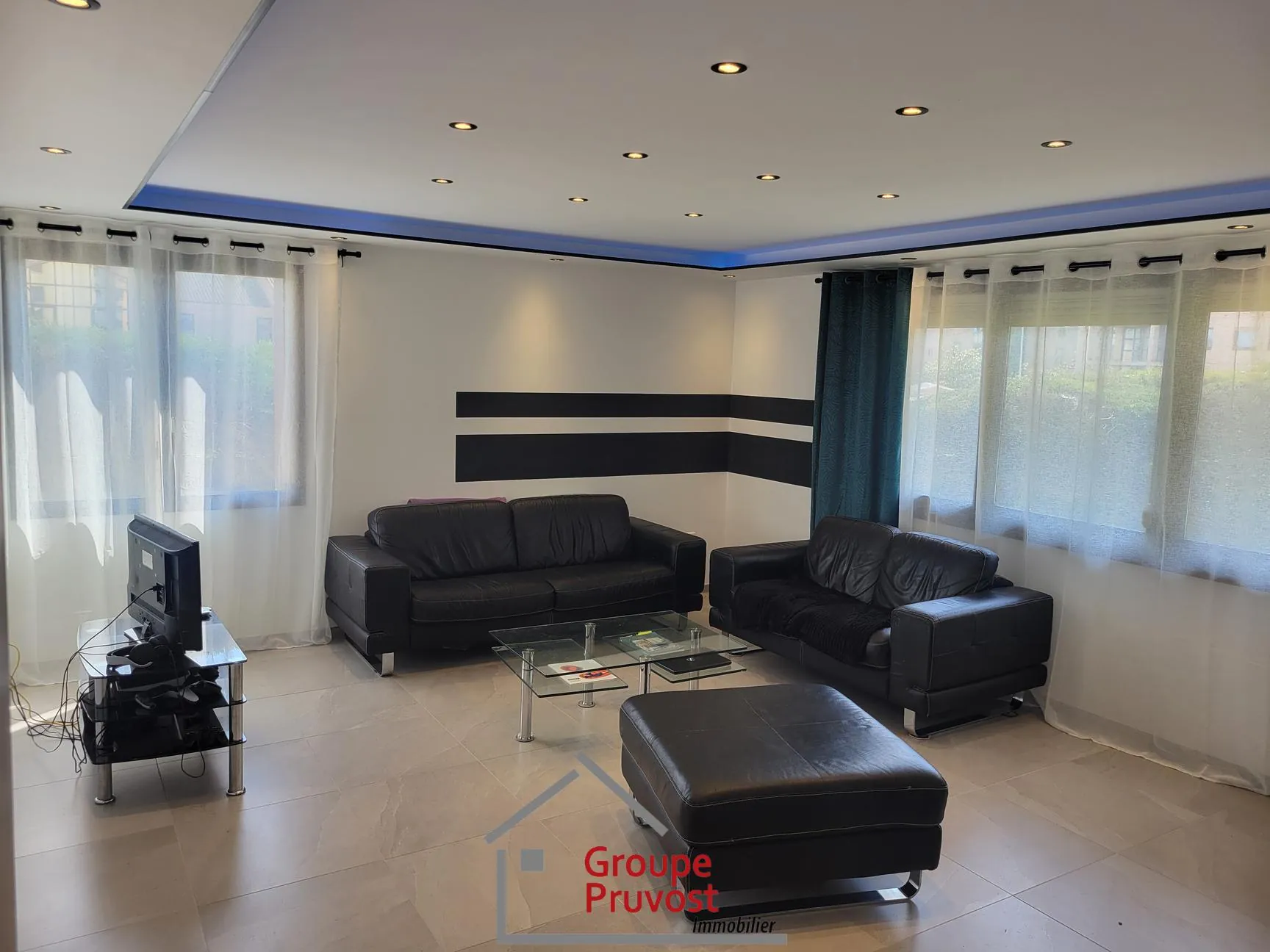 Bel appartement T4 en rez-de-jardin à Roanne avec 3 chambres et jardin commun 
