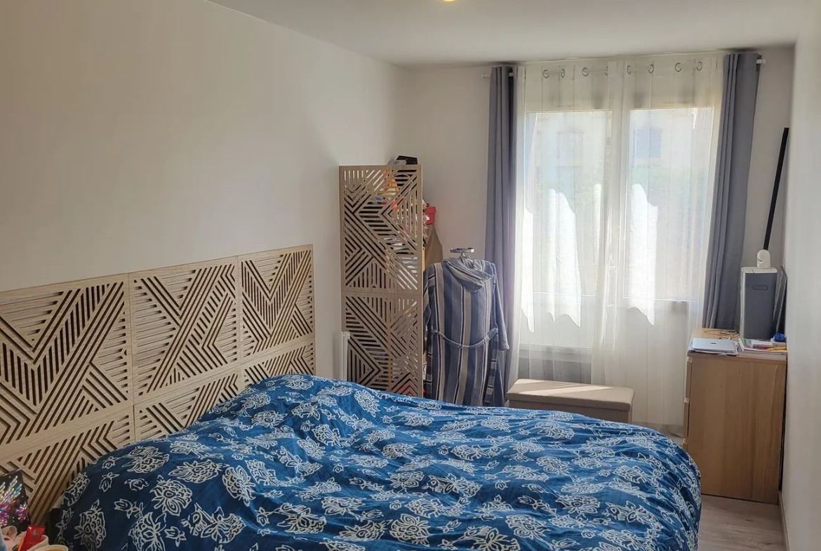 Bel appartement T4 en rez-de-jardin à Roanne avec 3 chambres et jardin commun 