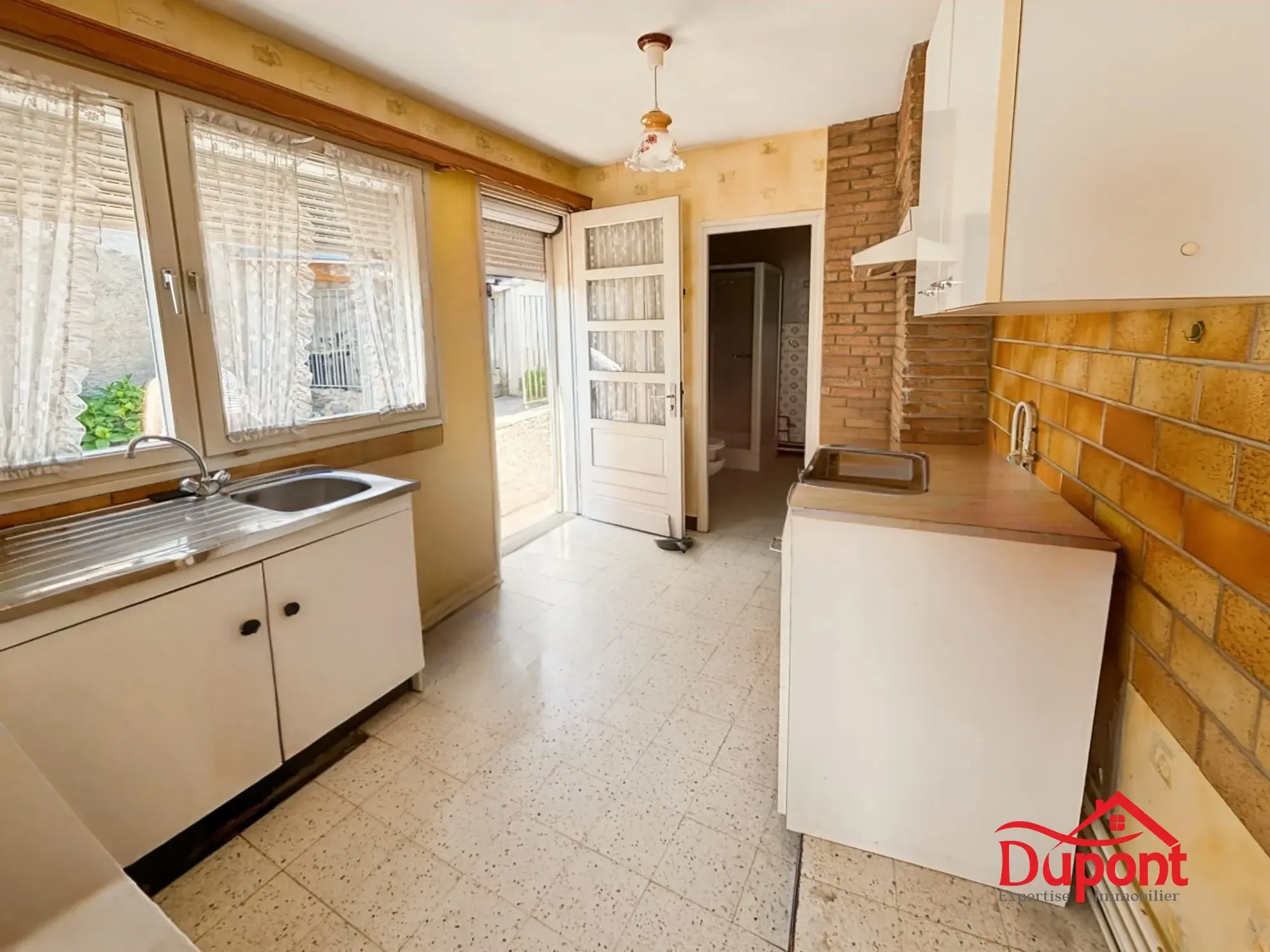 Maison semi-individuelle à Haveluy avec grand jardin et potentiel de rénovation 