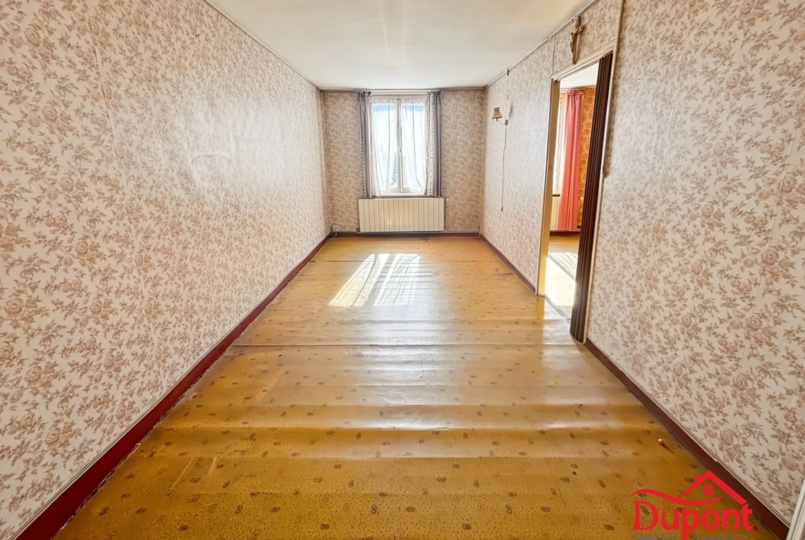 Maison semi-individuelle à Haveluy avec grand jardin et potentiel de rénovation 