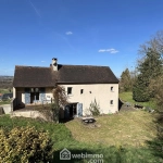 Maison en pierre avec extension à Colombiers - 107 m², 3 chambres, garage, terrain boisé