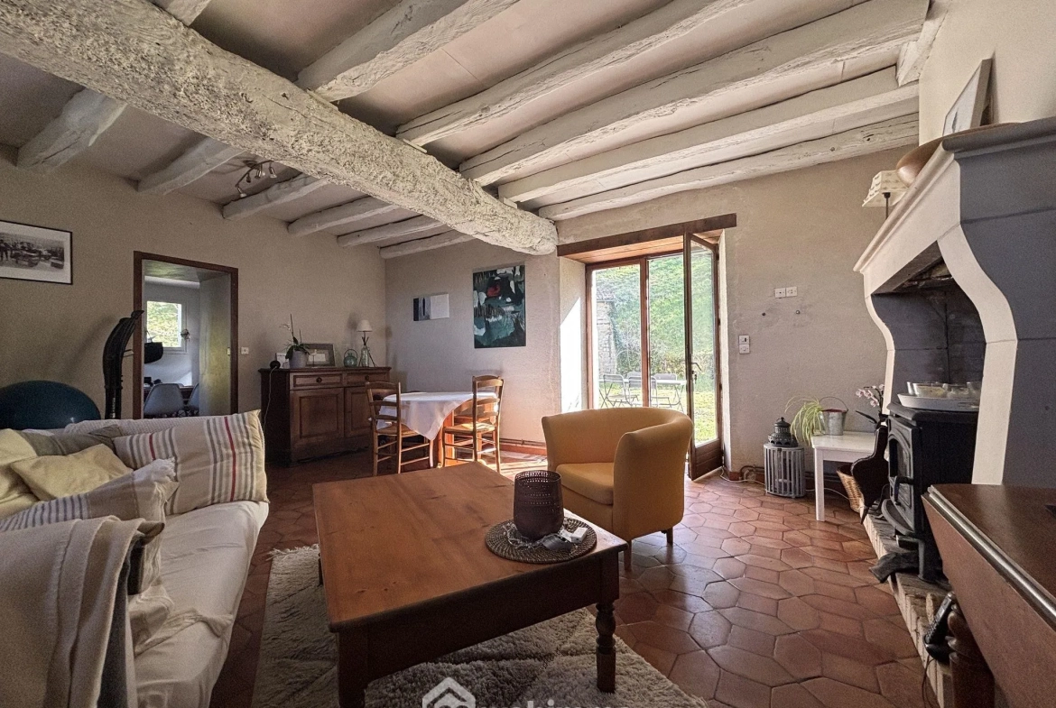 Maison en pierre avec extension à Colombiers - 107 m², 3 chambres, garage, terrain boisé 