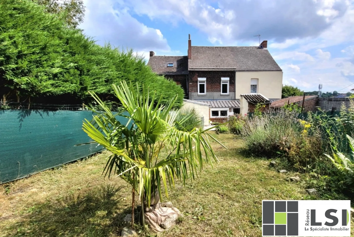 Maison mitoyenne 3 chambres à Hautmont avec jardin et potentiel de rénovation 