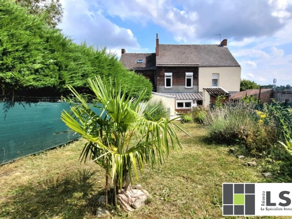 Maison mitoyenne 3 chambres à Hautmont avec jardin et potentiel de rénovation