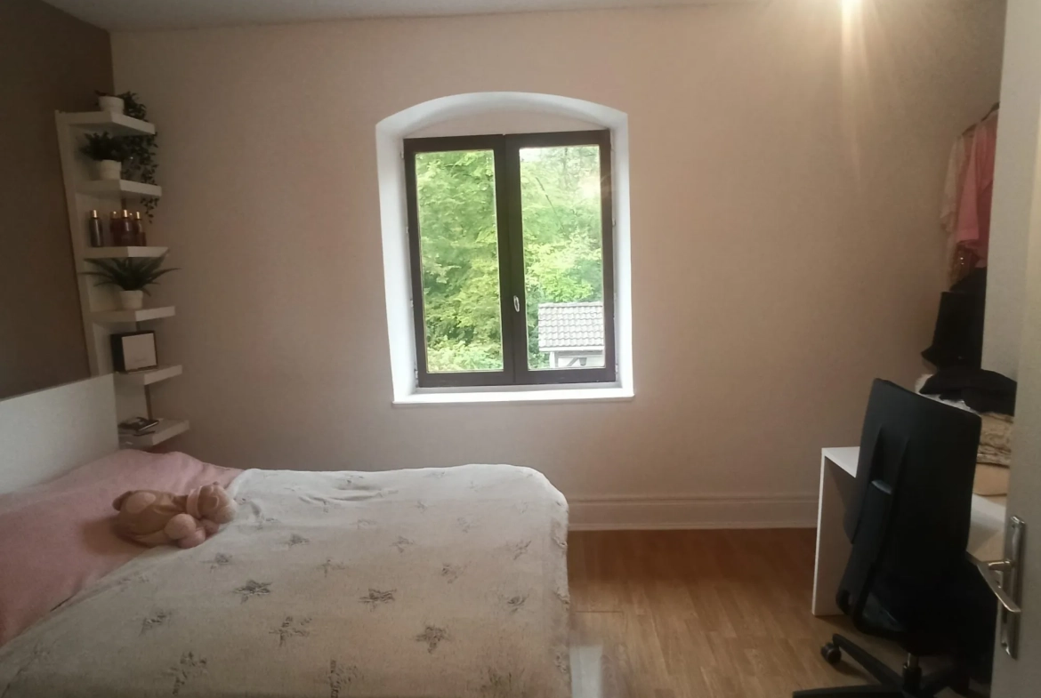 Maison à vendre à Danjoutin – 130 m², terrain de 22 ares, potentiel familial dans cadre verdoyant 