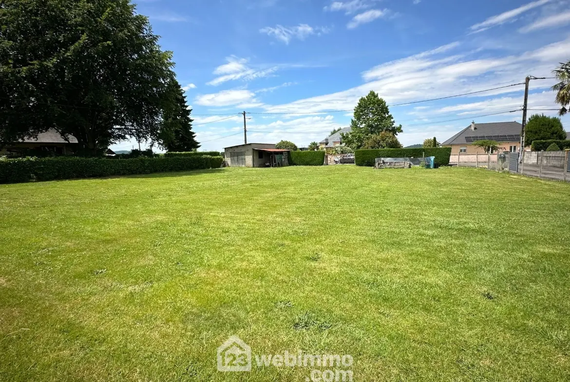 Terrain constructible de 1200 m² à Bœil-Bezing - Cadre calme et verdoyant 