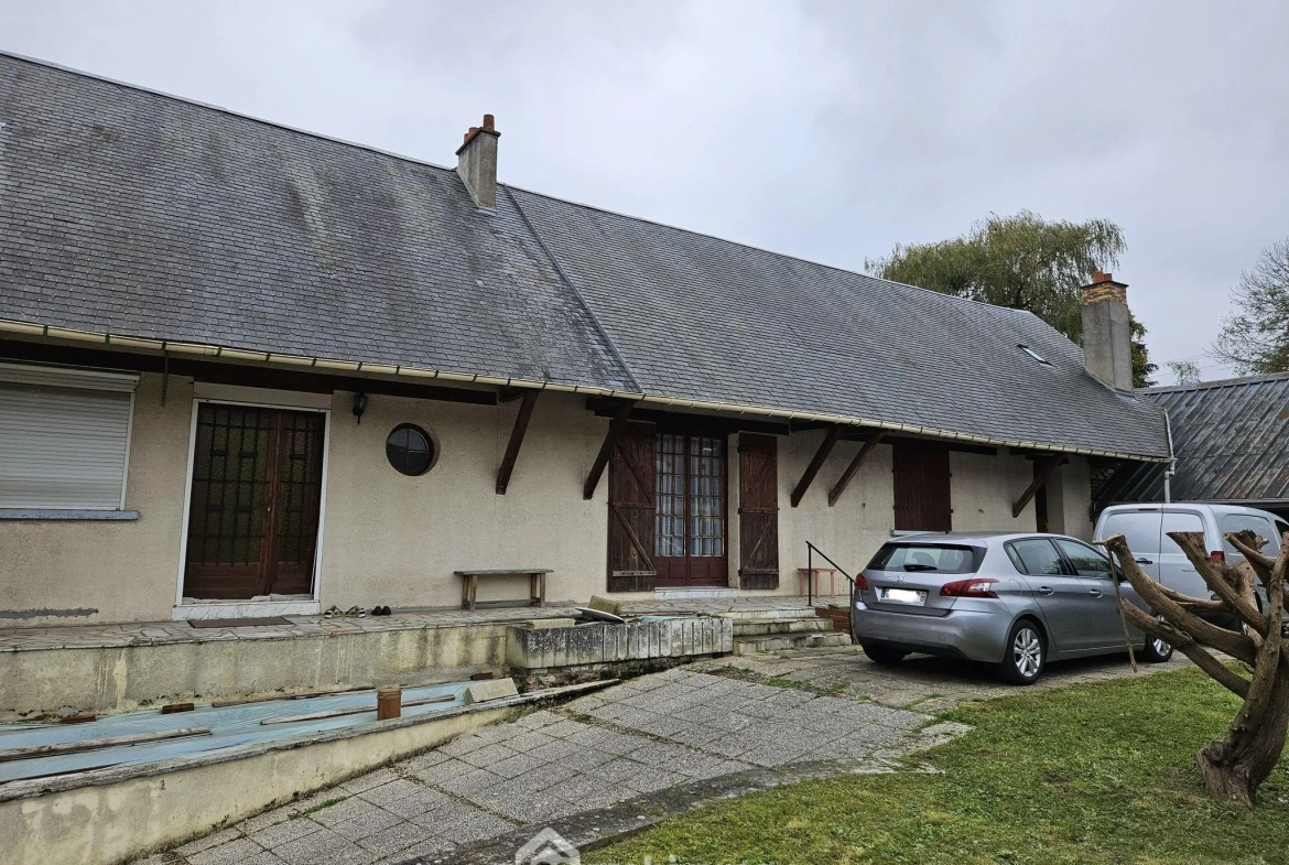 Charmante longère en briques et ardoises avec garage et terrain clos à Rouy 