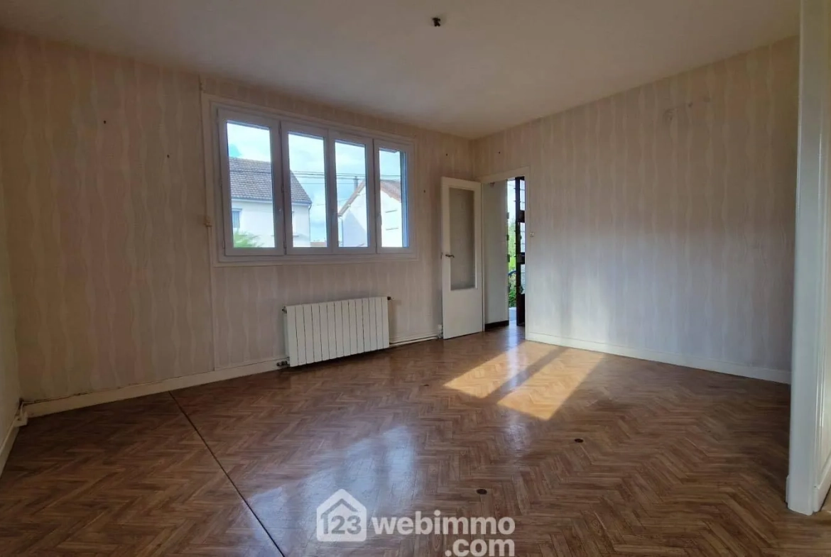 Maison de plain-pied avec sous-sol à Laon - 2 chambres, garage et atelier 