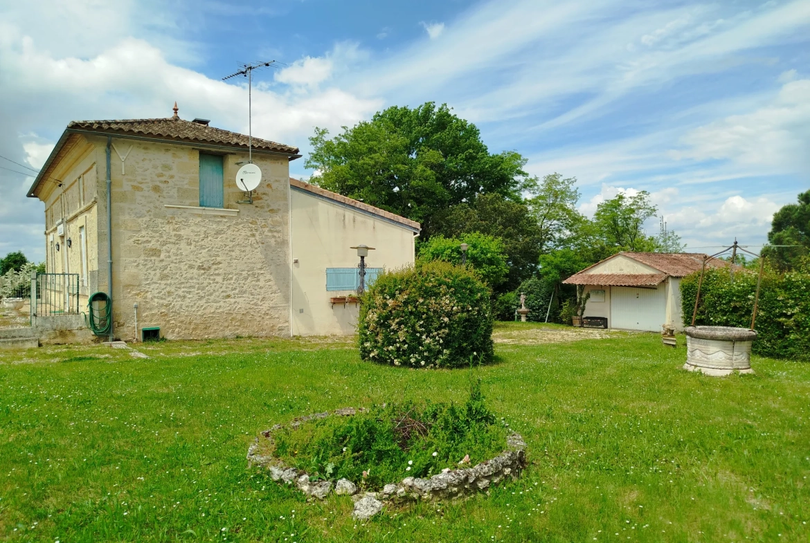 Charmante maison en pierre avec garage, cave et jardin à Doulezon 