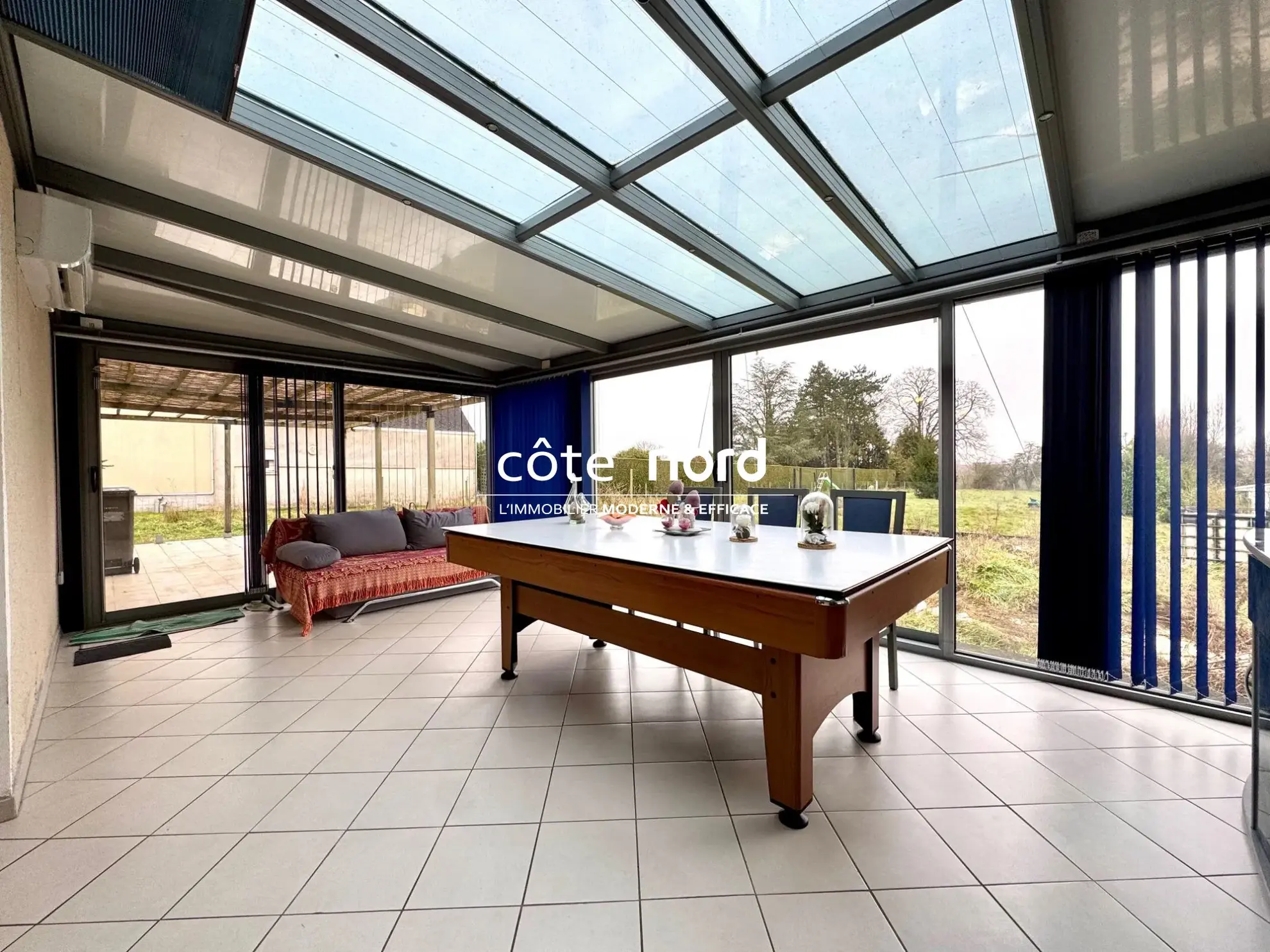 Pavillon individuel de plain-pied proche Caudry avec garage et grande véranda 