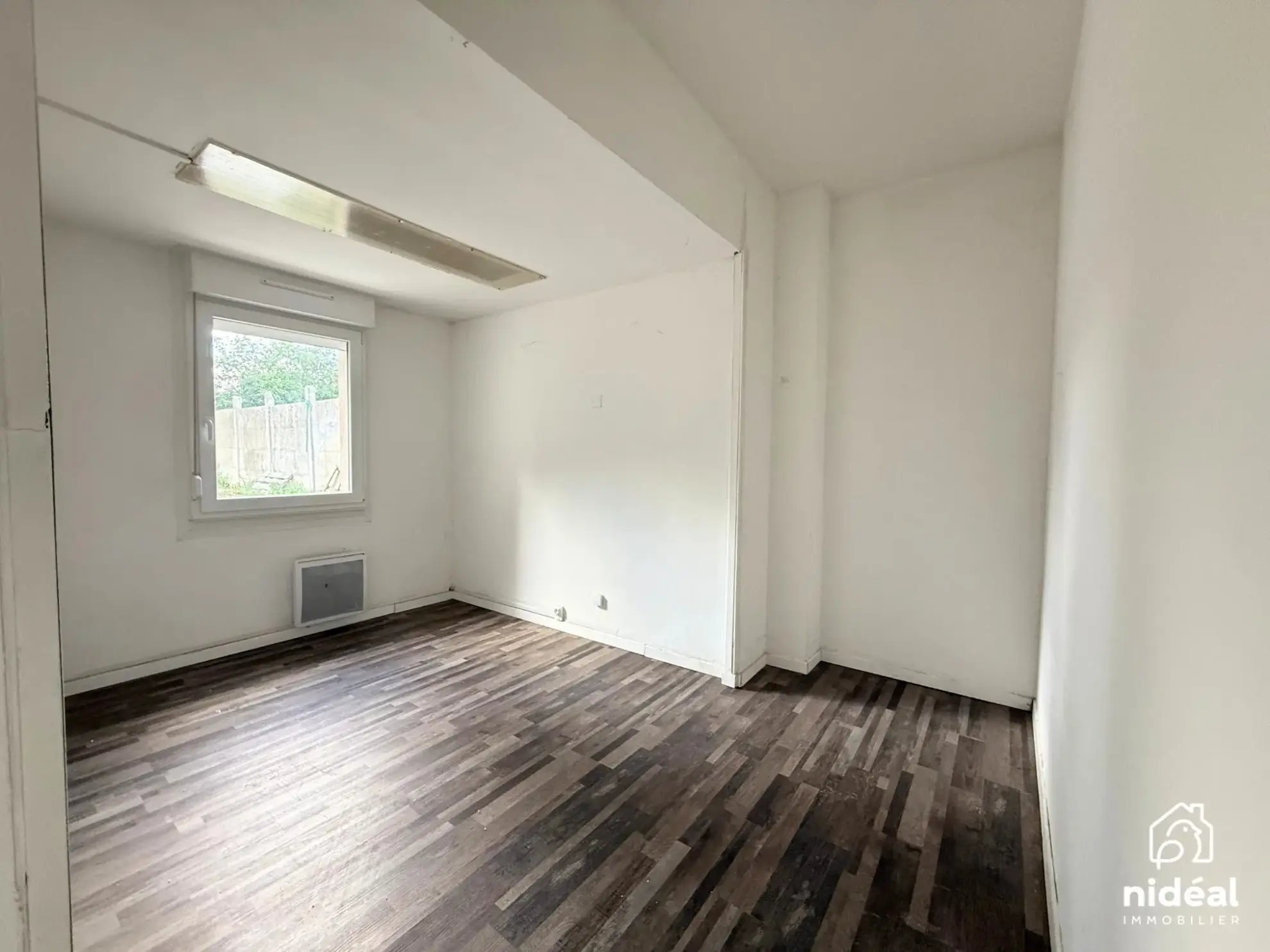 Immeuble de rapport à vendre à Jeumont avec deux lots et jardin 