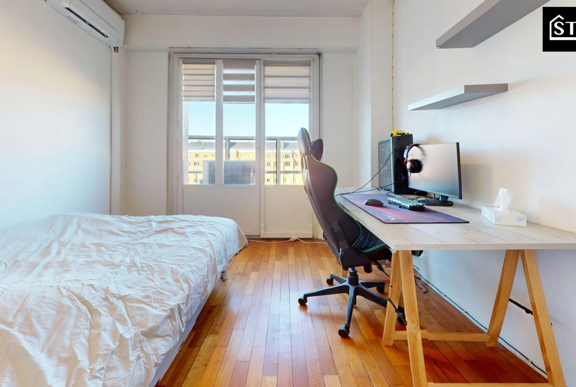 Appartement T4 lumineux avec balcon et cave à Belfort, proximité centre-ville 