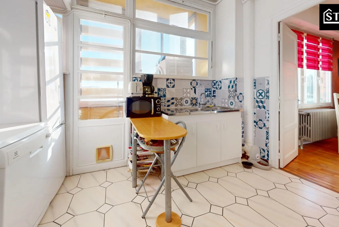 Appartement T4 lumineux avec balcon et cave à Belfort, proximité centre-ville 