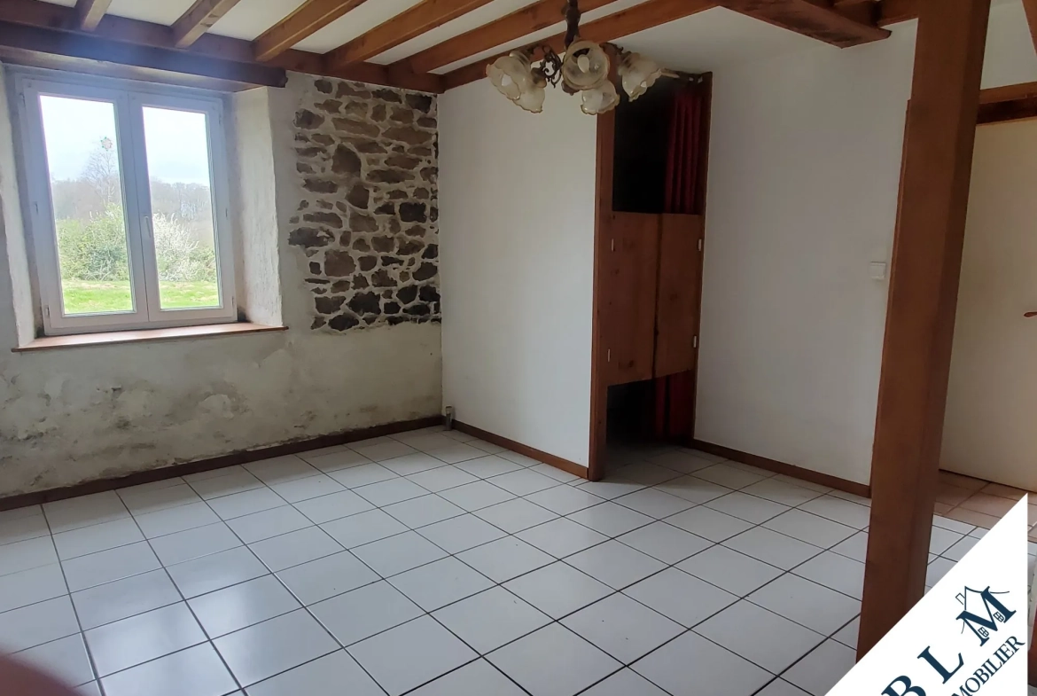 Maison en pierre à rénover à Carneville - 92m² avec dépendance et jardin 