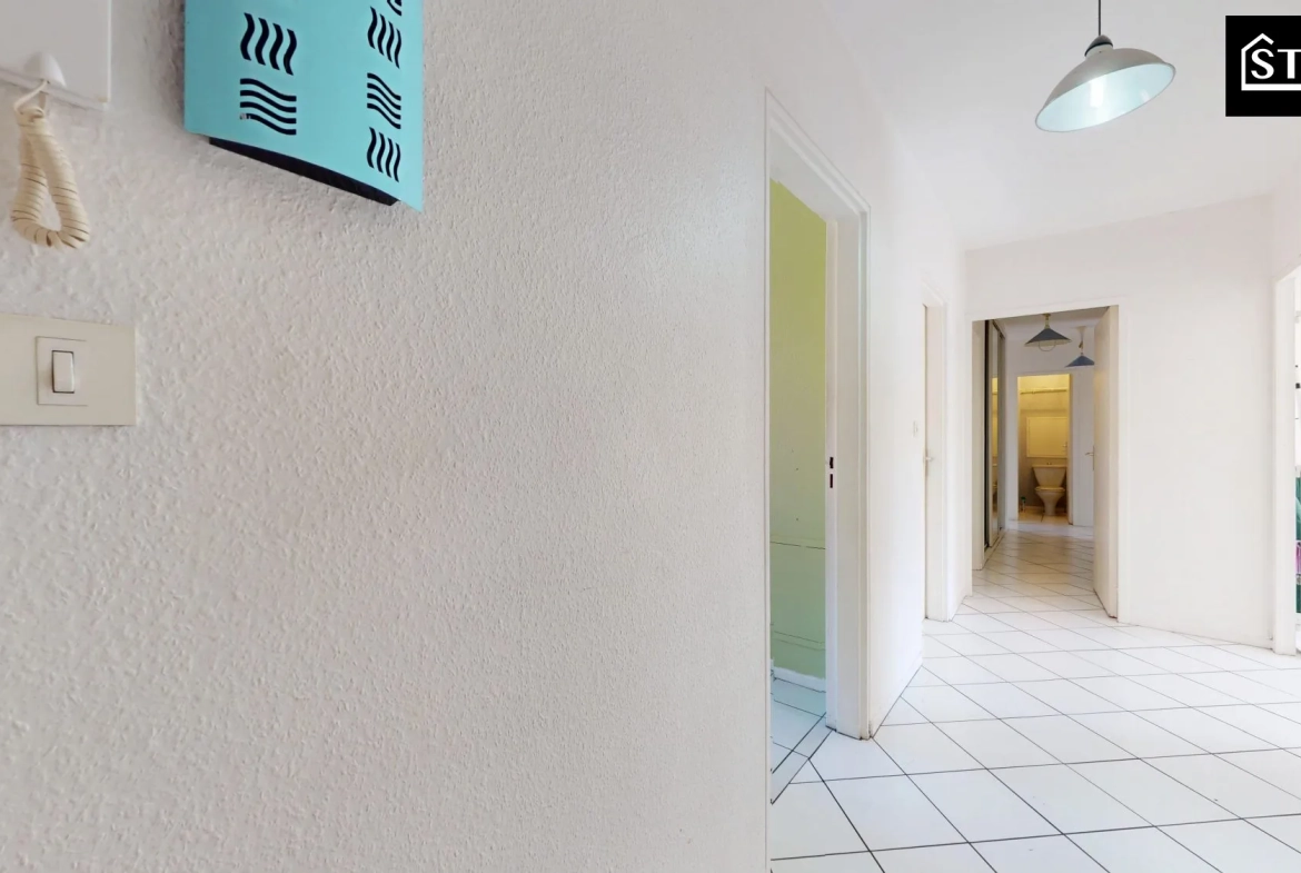 Appartement T4/T5 lumineux avec ascenseur, cave et parking au centre de Belfort 